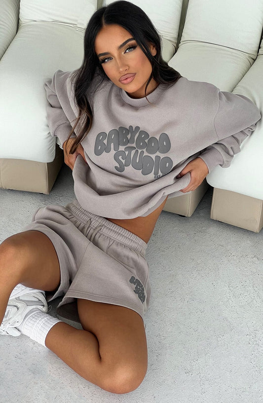 https://cdn.shopify.com/s/files/1/2060/7491/files/studio-sweater-mocha-charcoal-tops-xs-s-babyboo-fashion-31198185193535.jpg?v=1748603285